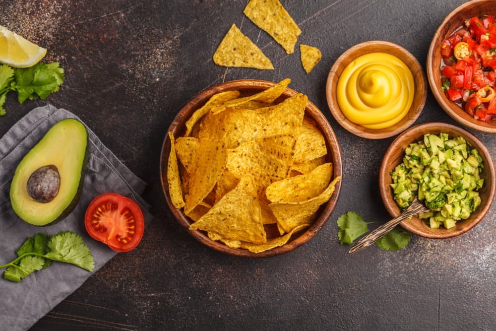 Tortilla chips with avocado and cheese